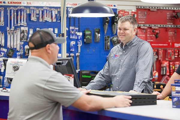 RHI Supply sales team member helping customer.