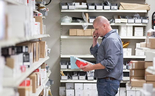 RHI Supply staff picking HVAC parts for customer order in the supply warehouse.